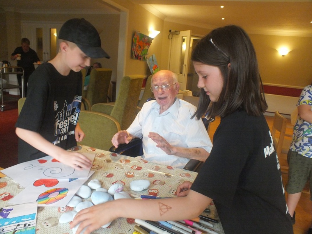 James and James and Evelyn having fun with residents.