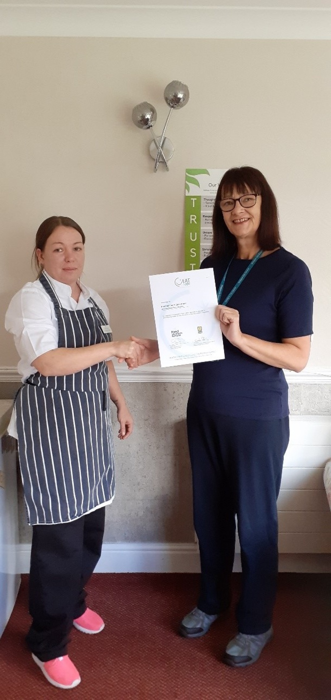 Head Chef Jacqueline (left) receiving the award.