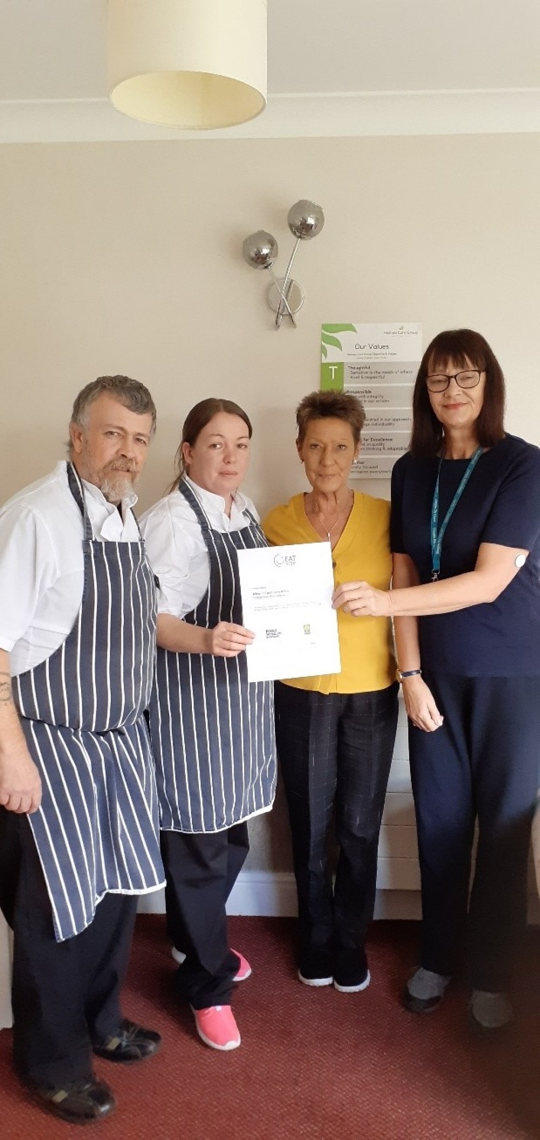 Almond Court staff presented with their award.